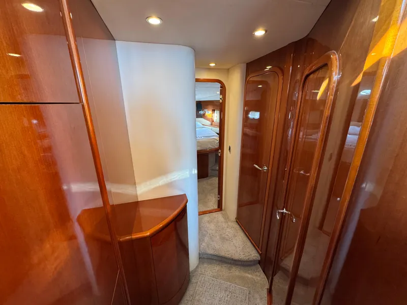Slide: The Image of Luxurious interior hallway of 2005 Viking Princess 50 Flybridge yacht with wooden finishes. - 18