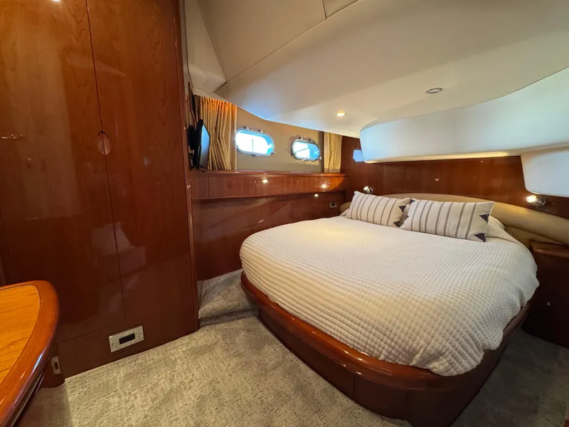 Slide: The Image of Luxurious cabin interior of 2005 Viking Princess 50 Flybridge yacht with cozy bed. - 19
