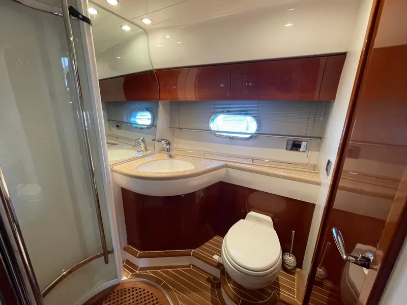 Slide: The Image of Luxurious bathroom in 2005 Viking Princess 50 Flybridge yacht with modern fixtures and wood accents. - 23