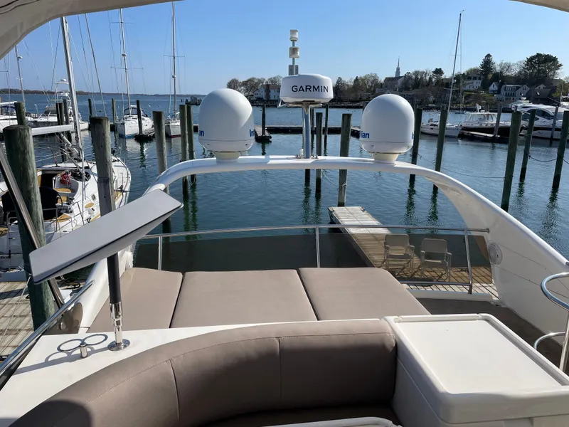 Slide: The Image of Flybridge view of 2005 Viking Princess 50 yacht docked at marina. - 33