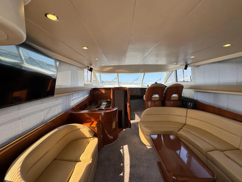 Slide: The Image of Luxurious interior of 2005 Viking Princess 50 Flybridge yacht with elegant seating and panoramic windows. - 6