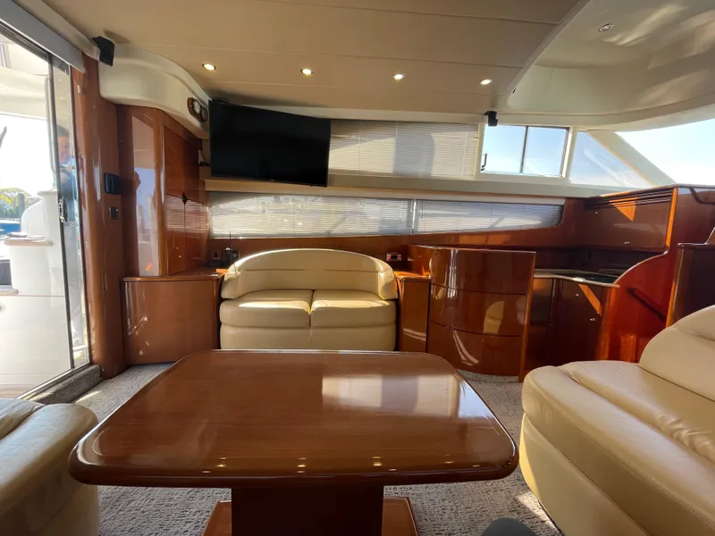 Slide: The Image of Luxurious interior of 2005 Viking Princess 50 Flybridge yacht with elegant seating and wood finishes. - 7