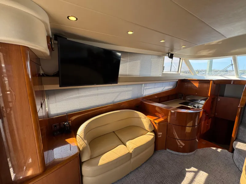 Slide: The Image of Luxurious 2005 Viking Princess 50 Flybridge interior with TV, sofa, and modern design. - 8