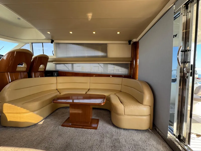 Slide: The Image of Luxurious interior of 2005 Viking Princess 50 Flybridge yacht with beige leather seating. - 9