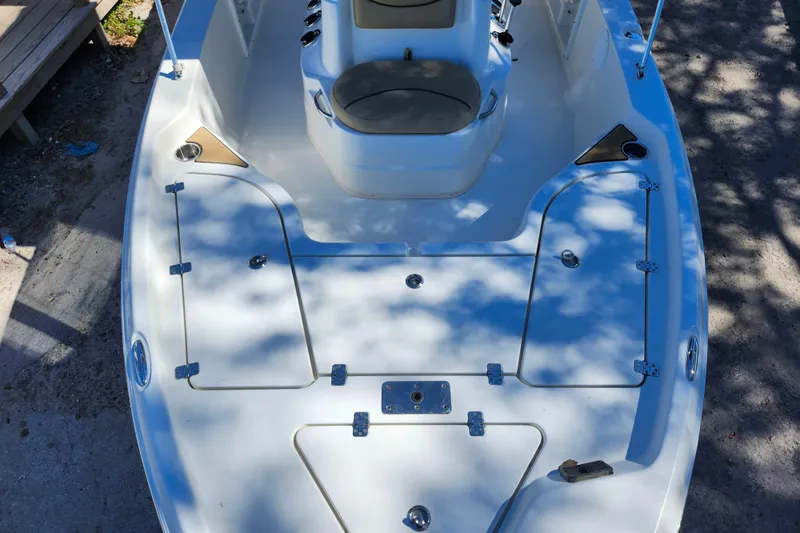 Slide: The Image of 2020 NauticStar 195 NauticBay boat deck with storage compartments and seating. - 10