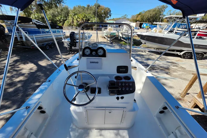 Slide: The Image of 2020 NauticStar 195 NauticBay boat interior with steering wheel and control panel. - 20