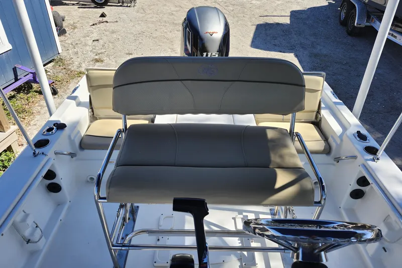 Slide: The Image of 2020 NauticStar 195 NauticBay boat interior with seating and steering wheel. - 21