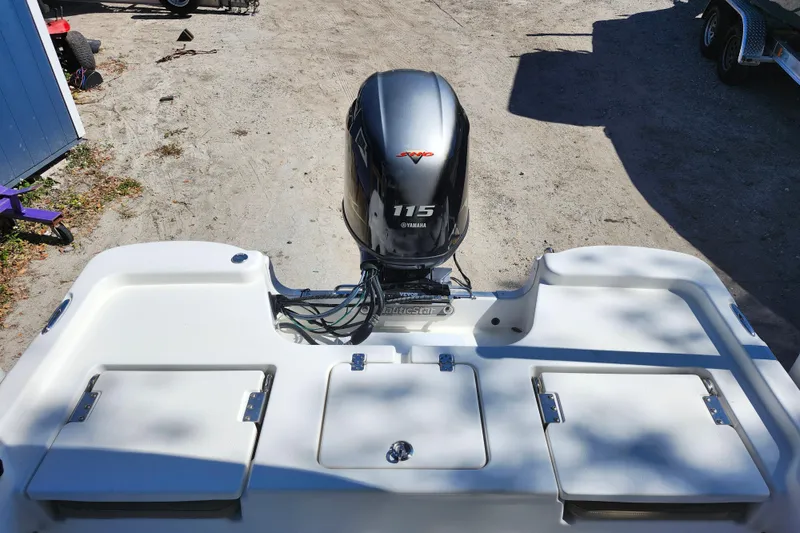 Slide: The Image of 2020 NauticStar 195 NauticBay boat with Yamaha 115 engine, rear view. - 25