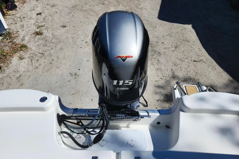 Slide: The Image of 2020 NauticStar 195 NauticBay with Yamaha 115 outboard motor, rear view. - 26