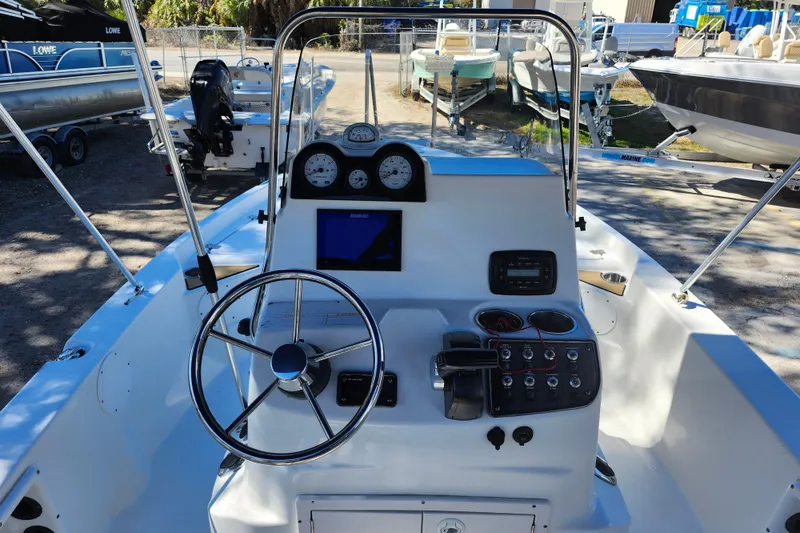 Slide: The Image of 2020 NauticStar 195 NauticBay boat dashboard with steering wheel and control panel. - 31