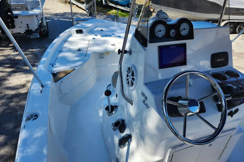 Slide: The Image of 2020 NauticStar 195 NauticBay boat interior with steering wheel and control panel. - 32