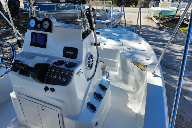 Slide: The Image of 2020 NauticStar 195 NauticBay boat interior with control panel and seating area. - 33