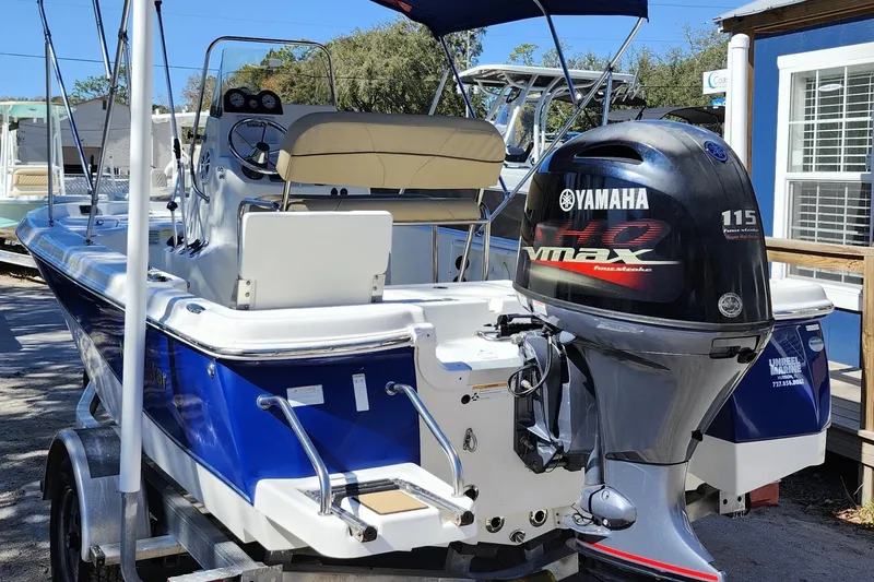 Slide: The Image of 2020 NauticStar 195 NauticBay boat with Yamaha 115 VMAX engine, parked on trailer. - 4