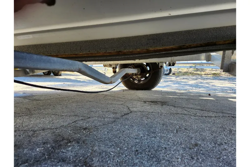 Slide: The Image of Underneath view of a 2020 NauticStar 195 NauticBay boat on a trailer. - 41