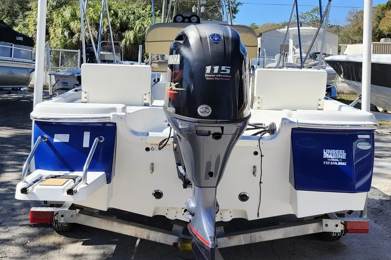 Slide: The Image of 2020 NauticStar 195 NauticBay boat with Yamaha 115 engine, parked on a trailer. - 5
