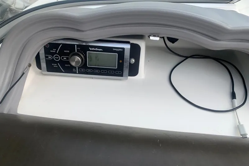 Slide: The Image of Yamaha AR230 2004 boat dashboard with Rockford Fosgate stereo system and cable. - 13