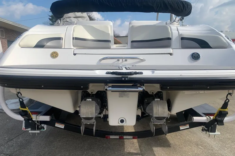 Slide: The Image of 2004 Yamaha Boats AR230 rear view, showcasing dual engines and sleek design. - 2