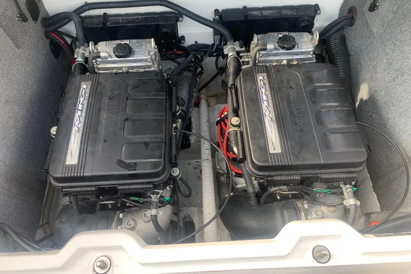 Slide: The Image of Twin engines of a 2004 Yamaha Boats AR230, showcasing detailed components. - 21