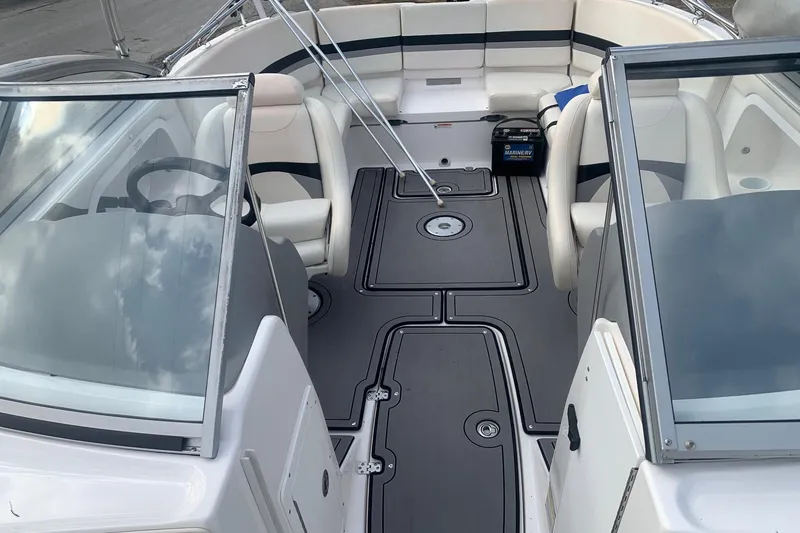 Slide: The Image of 2004 Yamaha Boats AR230 interior with seating and steering wheel, showcasing sleek design. - 9