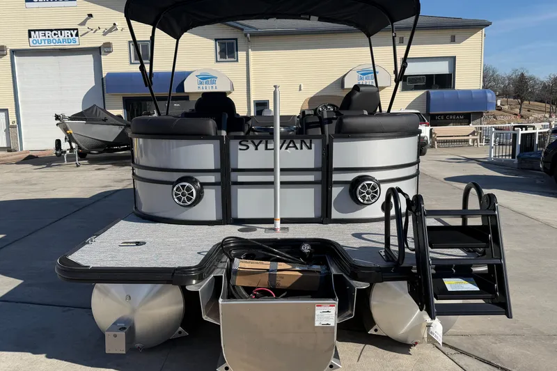 Slide: The Image of 2026 Sylvan Mirage X X3 pontoon boat at marina, featuring sleek design and modern amenities. - 3