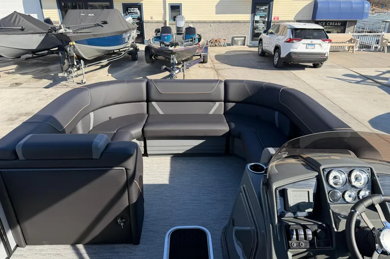 Slide: The Image of 2026 Sylvan Mirage X X3 pontoon boat with luxurious seating and modern dashboard. - 7