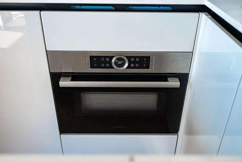 Slide: The Image of Modern built-in oven in Absolute 64 Navetta yacht kitchen, 2023 model. - 16