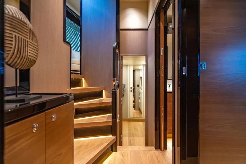 Slide: The Image of Luxurious interior of 2023 Absolute 64 Navetta yacht with modern wooden staircase. - 26