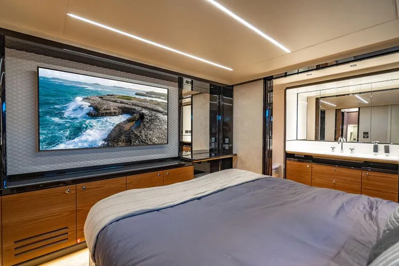 Slide: The Image of Luxurious bedroom interior of 2023 Absolute 64 Navetta yacht with modern decor and large TV. - 33