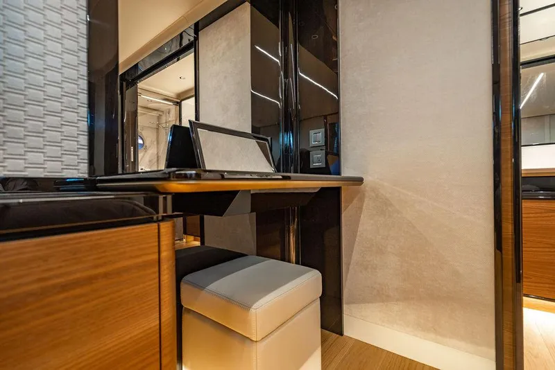 Slide: The Image of Luxurious interior of 2023 Absolute 64 Navetta yacht with modern desk and seating. - 34