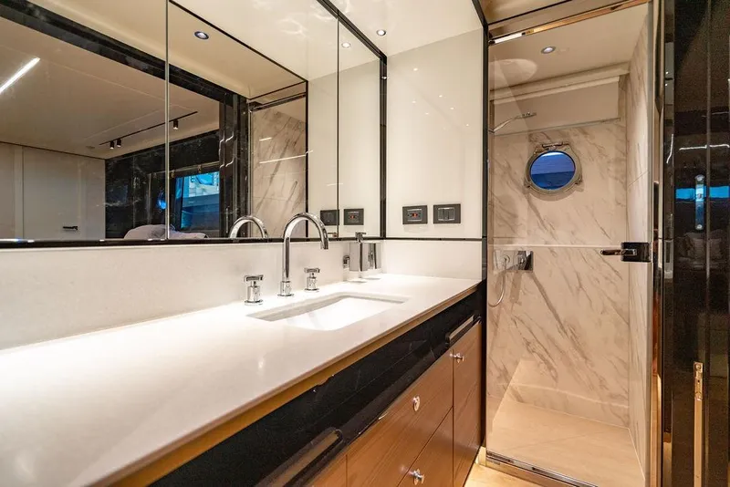 Slide: The Image of Luxurious bathroom in 2023 Absolute 64 Navetta yacht with modern fixtures and marble accents. - 35