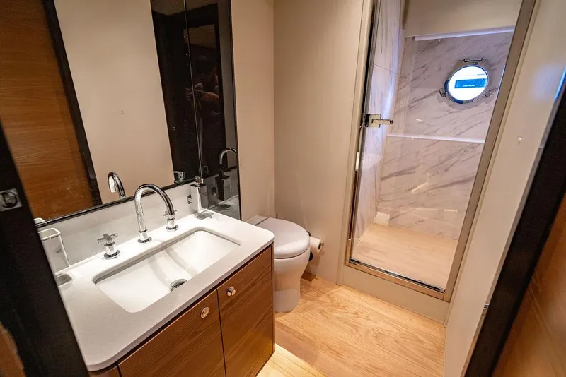 Slide: The Image of Luxurious bathroom in 2023 Absolute 64 Navetta yacht with modern fixtures and wooden flooring. - 40