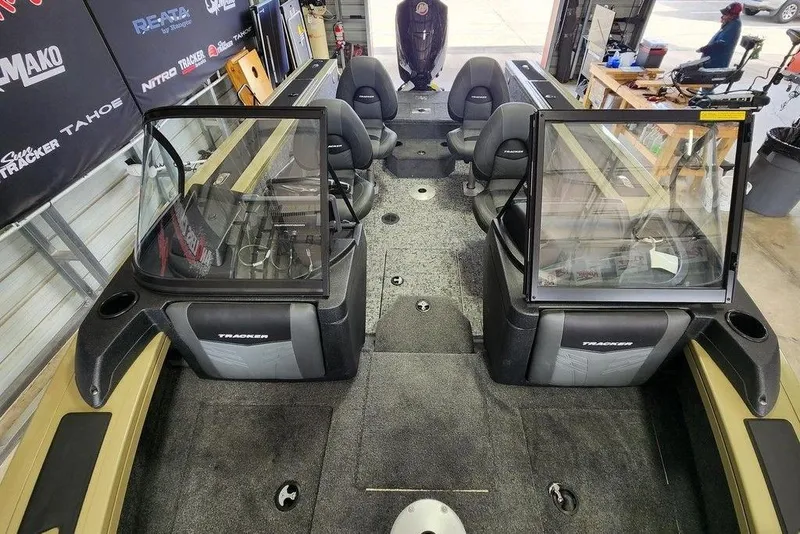 Slide: The Image of 2026 Tracker Targa 185 WT boat interior with seating and dashboard view. - 11
