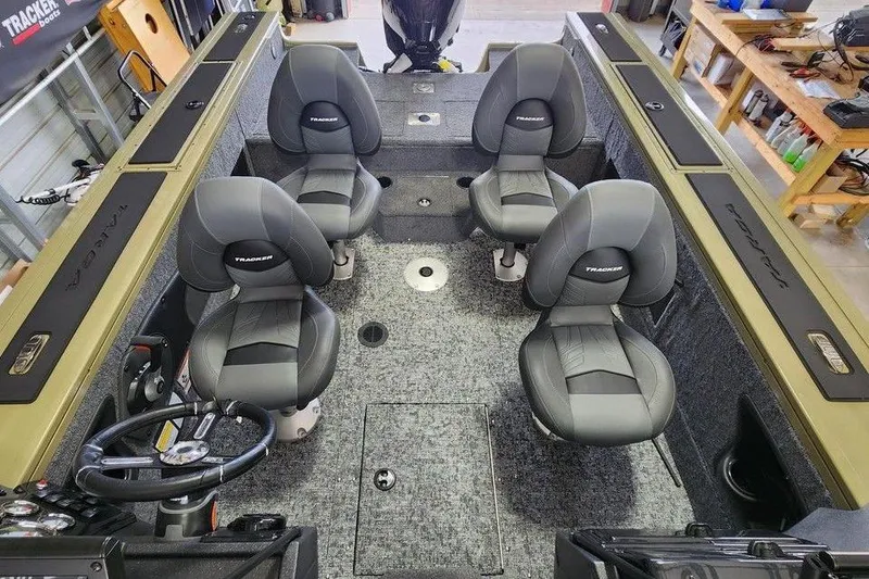 Slide: The Image of 2026 Tracker Targa 185 WT boat interior with four seats and steering wheel. - 12
