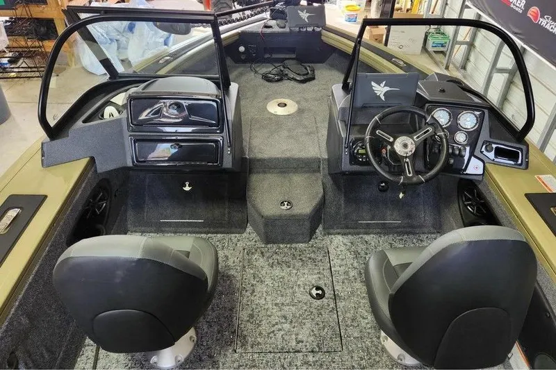 Slide: The Image of 2026 Tracker Targa 185 WT boat interior with dual seats and dashboard controls. - 6