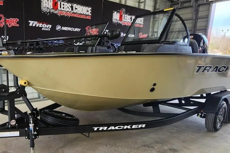 Slide: The Image of 2026 Tracker Targa 185 WT boat on trailer in showroom setting. - 7