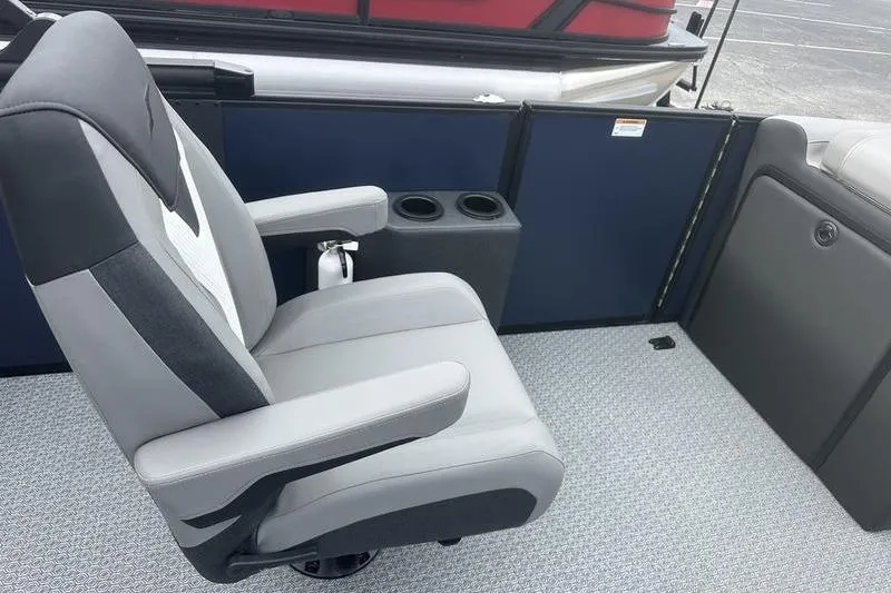 Slide: The Image of Gray captain's chair on Evotti 523CS boat, 2026 model, with cup holders and carpeted floor. - 14