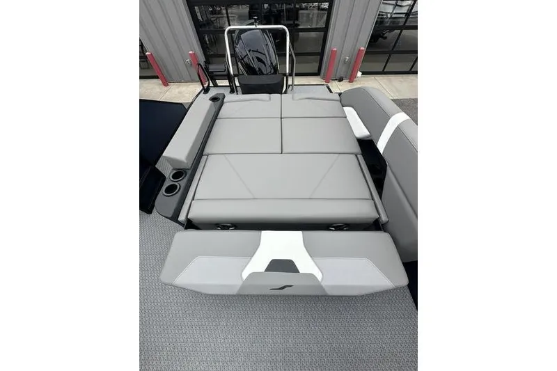 Slide: The Image of 2026 Evotti 523CS boat interior with gray seating and cup holders. - 17
