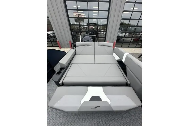 Slide: The Image of 2026 Evotti 523CS boat interior with gray seating and cup holders. - 19