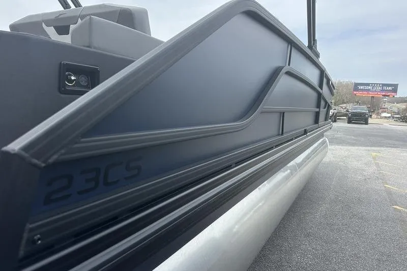 Slide: The Image of 2026 Evotti 523CS pontoon boat side view in a parking lot. - 5