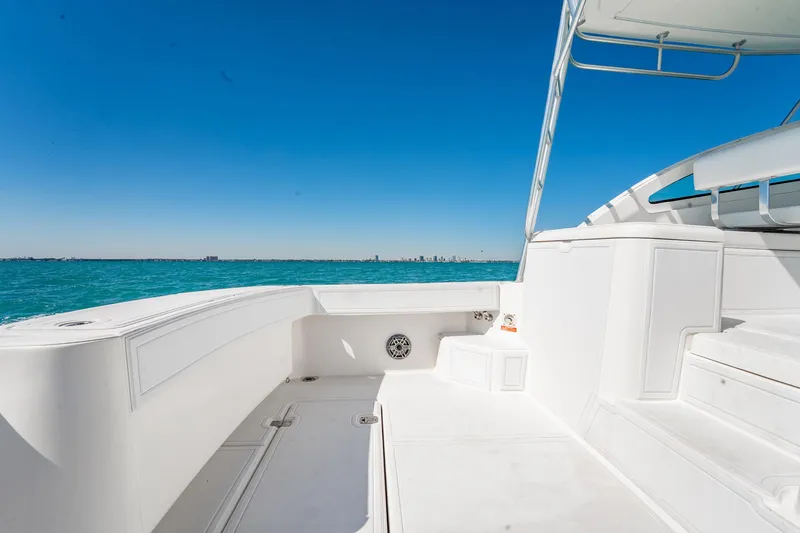Slide: The Image of 2004 Luhrs 32 Open boat deck with ocean view and clear blue sky. - 11