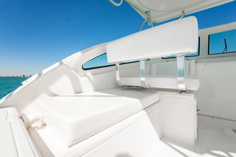 Slide: The Image of 2004 Luhrs 32 Open boat interior with white seating and ocean view. - 17