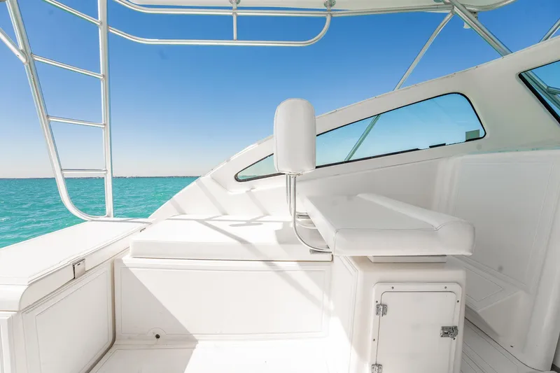 Slide: The Image of 2004 Luhrs 32 Open boat interior with white seating and ocean view. - 25