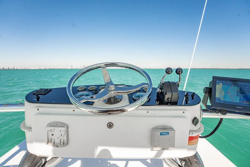 Slide: The Image of Helm of 2004 Luhrs 32 Open boat with steering wheel and navigation system. - 27