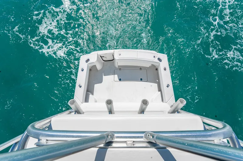 Slide: The Image of 2004 Luhrs 32 Open boat deck overlooking turquoise ocean waters. - 31