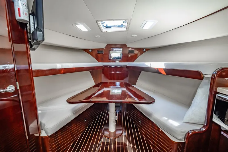 Slide: The Image of Luxurious interior of 2004 Luhrs 32 Open yacht with polished wood and cozy seating. - 36