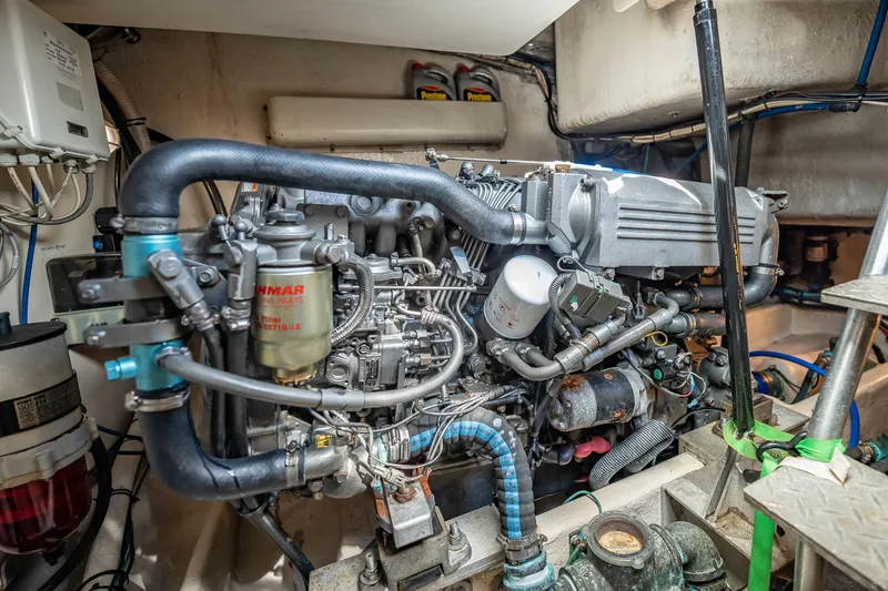 Slide: The Image of Engine room of 2004 Luhrs 32 Open boat, showcasing detailed mechanical components. - 44