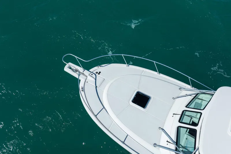 Slide: The Image of 2004 Luhrs 32 Open boat on clear turquoise water, aerial view. - 48