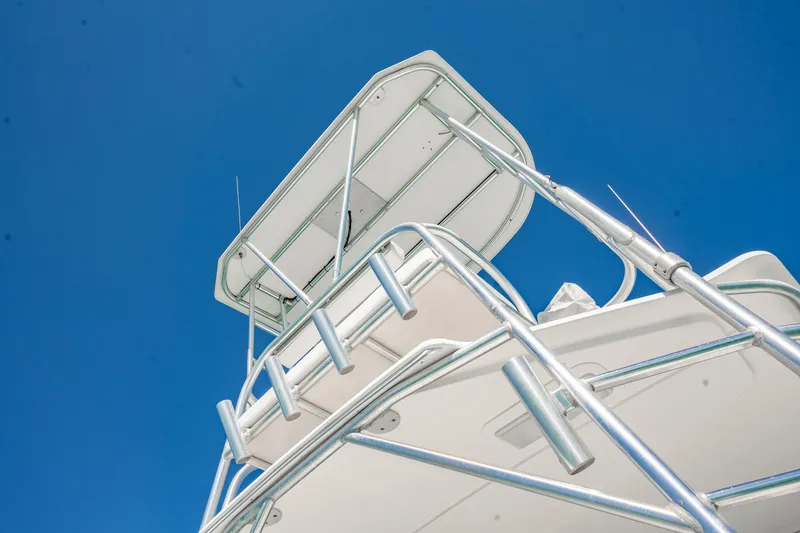 Slide: The Image of 2004 Luhrs 32 Open boat tower against clear blue sky. - 78