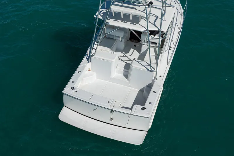 Slide: The Image of 2004 Luhrs 32 Open boat on clear blue water, aerial view. - 8