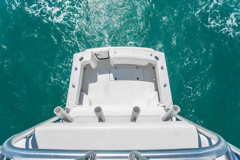 Slide: The Image of 2004 Luhrs 32 Open boat deck overlooking turquoise ocean water. - 80